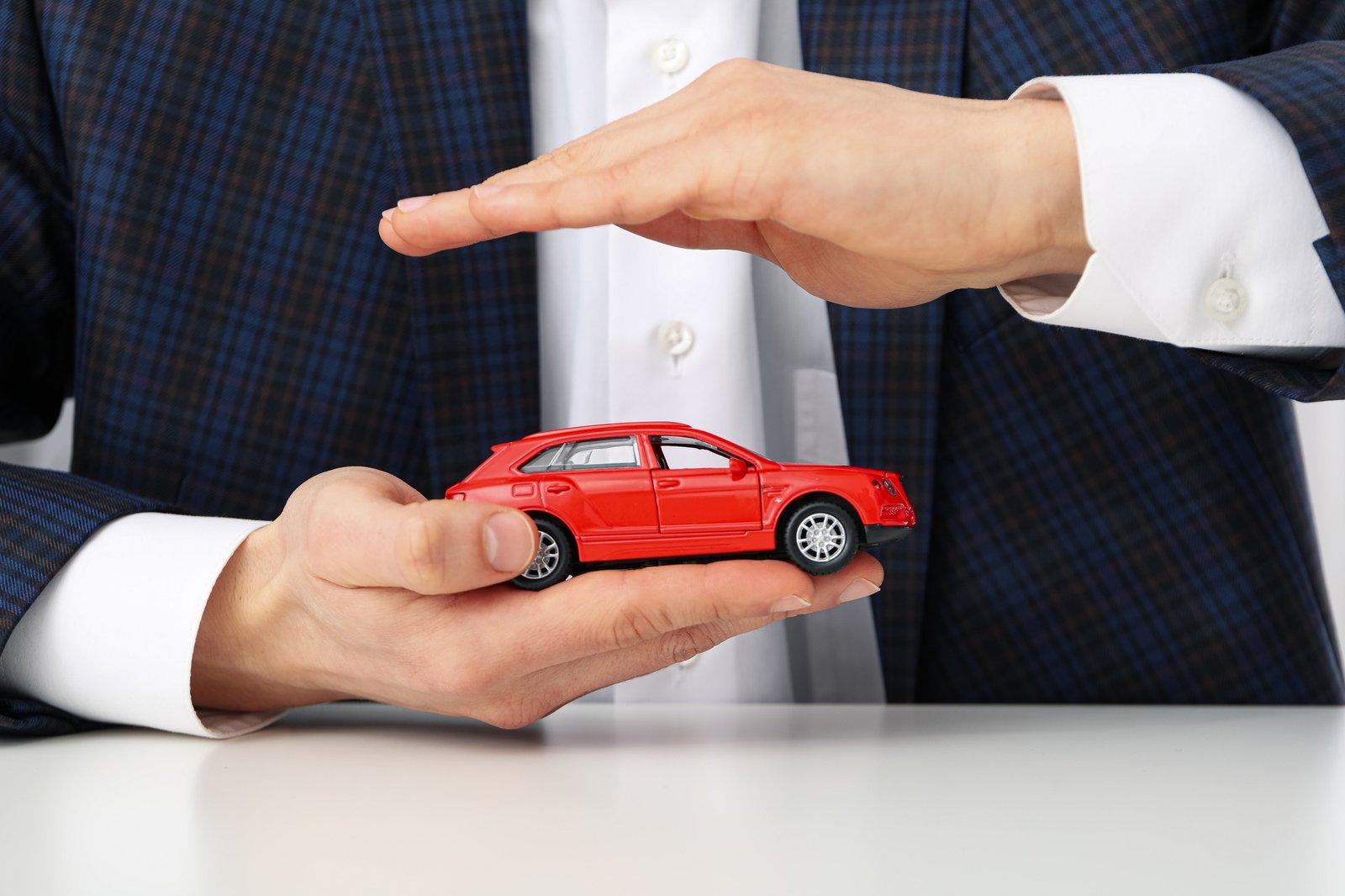 Concept of car purchase and insurance with toy car